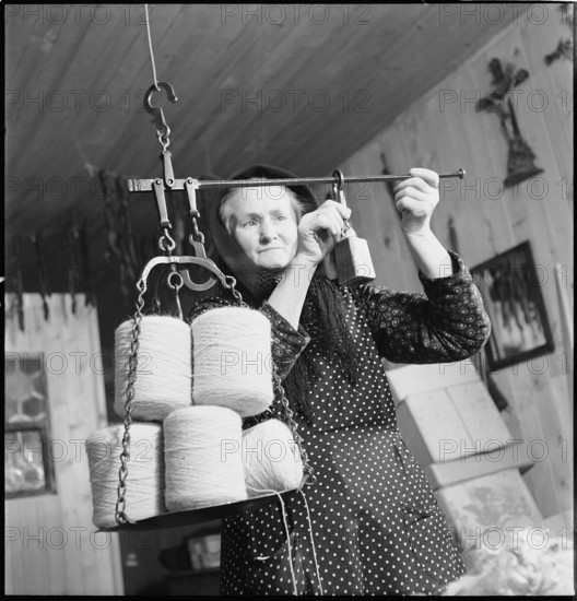 Woman weighing wool, 1945