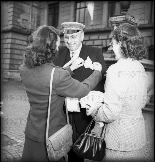 Woman arranging a man's handkerchief, Winterthur 1949