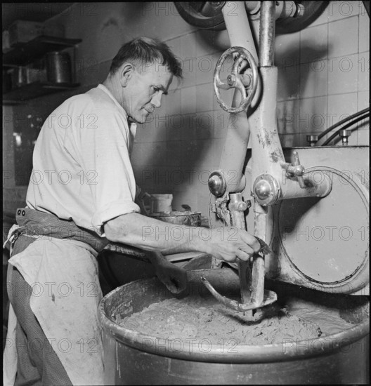 Baker in the bakery, kneading machine; 1943