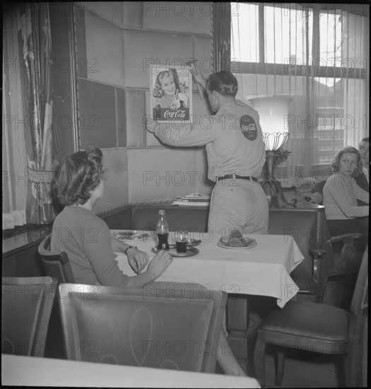 CocaCola supplier placing advertisement; 1950