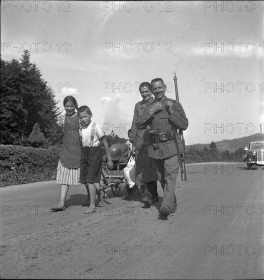 Soldier, returning home after discharge; 1940; 1940