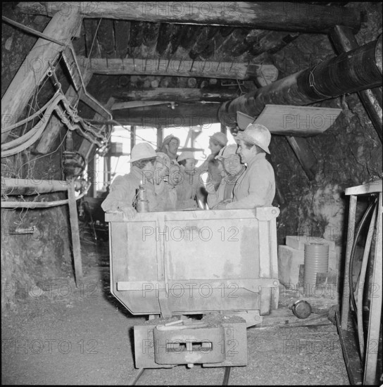 Workers in pressure tunnel, electric car, Safien 1956.