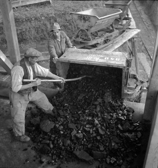 Miners; miner car in coal mine; 1941.