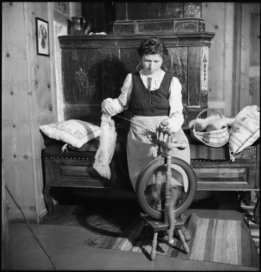 Woman spinning in weaving mill in the Münstertal, 1946.