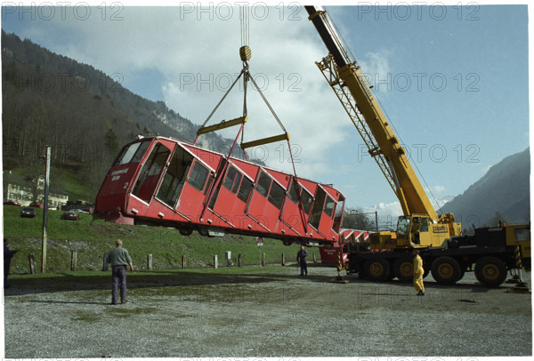 Crane lifting railway car, 1997.