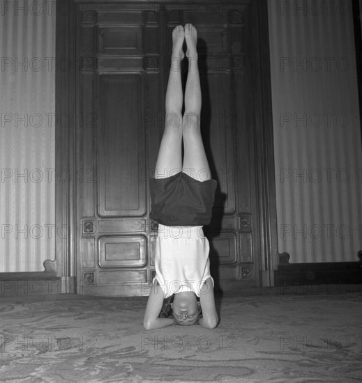 Woman doing yoga, 1953.