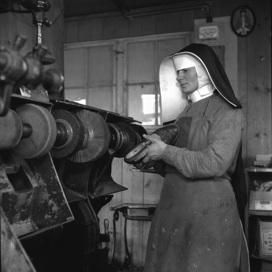 Sister Hugo, Switzerland's first shoemaker at work; 1944.