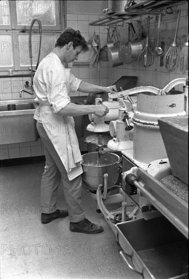 Berne, examinee running a kneading machine; 1970.