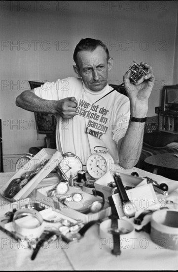 Chrampf-Olympiade; Man reparing alarm clock 1969.
