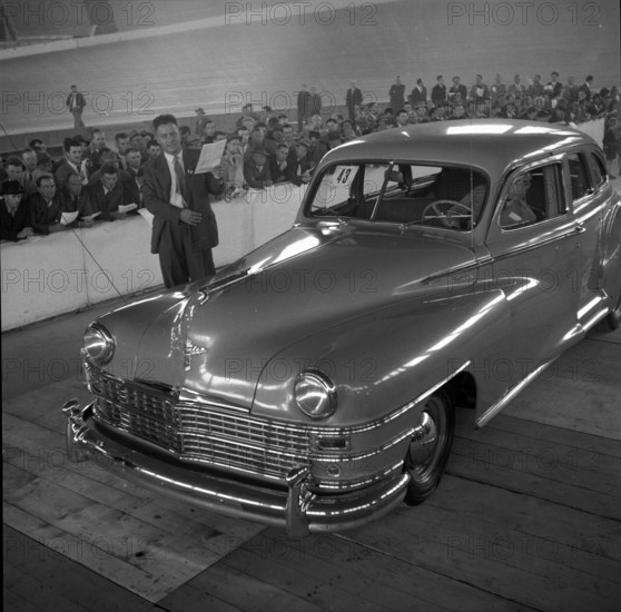 Auctioneer auctions Chrysler; 1955.