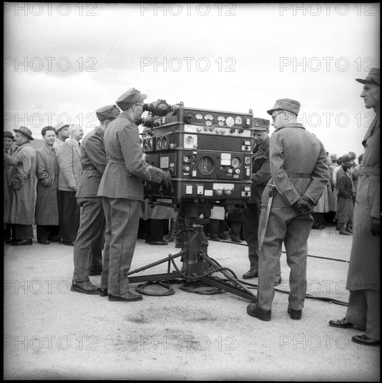 Soldiers at controls for anti aircraft guided arm, Berne 1951.
