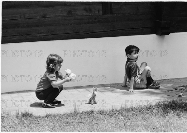 Farahnaz and Reza Cyrus Pahlavi playing in Gstaad, 1966.