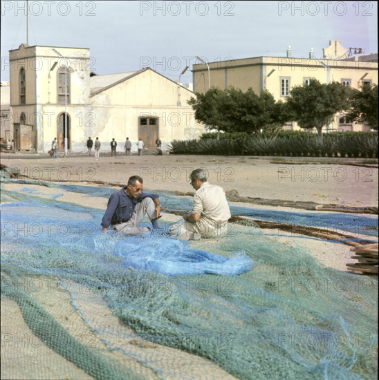 Fishermen repairing nets on Tenerife 1970.