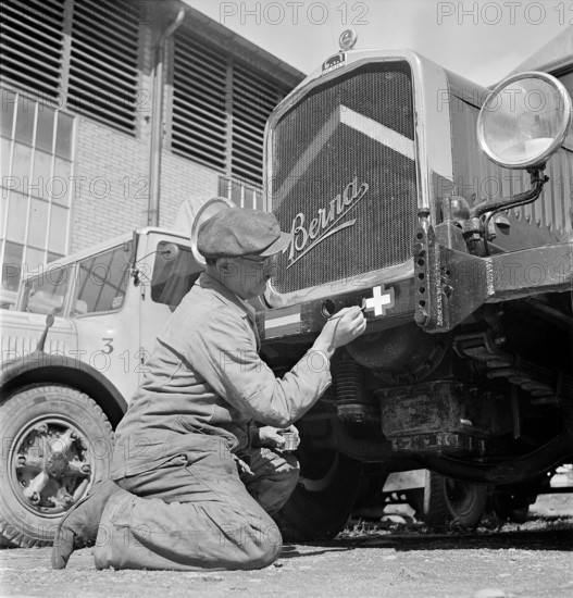 Spanish and Swiss national flag are painted on truck rear ; 1944.