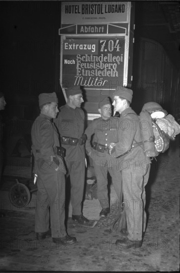 Soldiers at railway station; probably 1940.