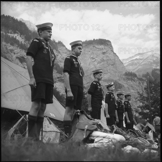 English boy scouts standing at attention in Kandersteg, 1950.