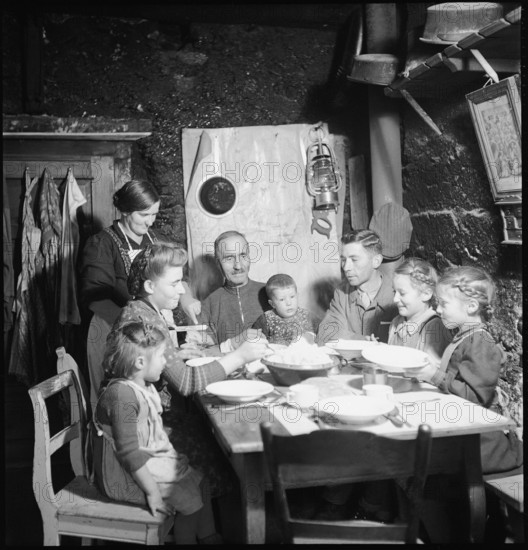 Family eating together, 1946.