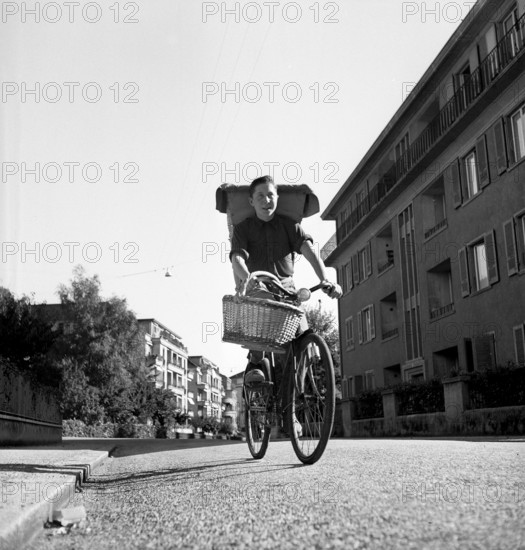 Boy delivering bread, 1949.