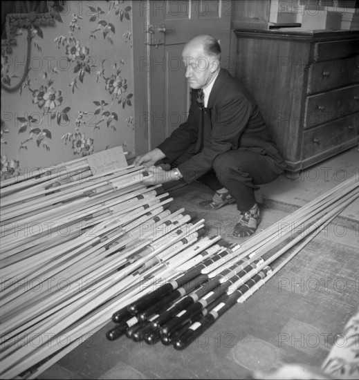 Man with hail defense rockets, 1951.