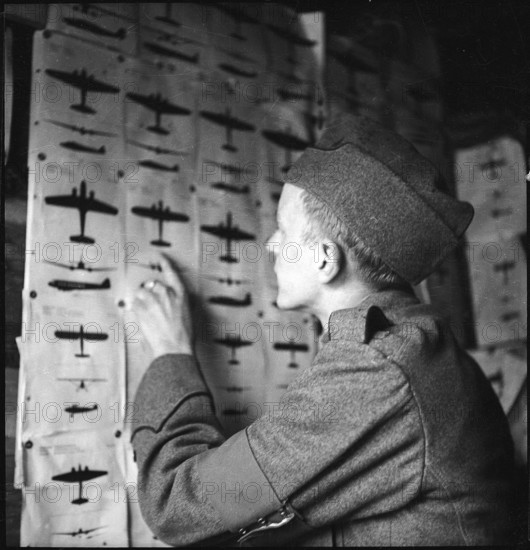 Antiaircraft soldier at aircraft table, Valais 1940