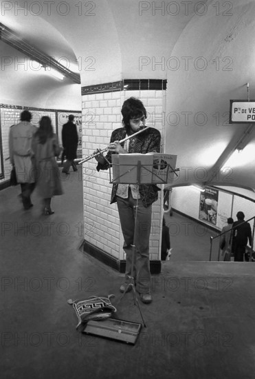 1975, Paris, subway, street musician.