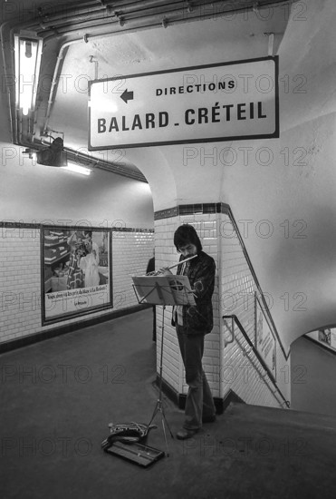 1975, Paris, subway, street musician.