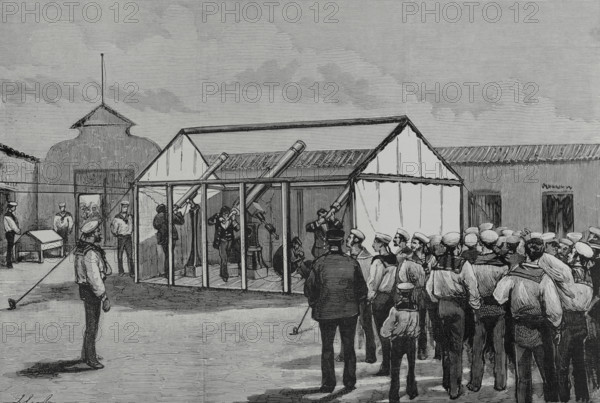 Manzanillo, Cuba. The Spanish scientific commission observing the passage of Venus through the solar disk, on 6 December 1882, under the presidency of the director of Royal Institute and Observatory of the Spanish Navy (Real Instituto y Observatorio de la Armada de San Fernando, Spain), Mr. Cecilio Pujazon (1833-1891). A provisional observatory was installed in the courtyard of the military hospital, at the Plaza del Fuerte, by the sea. This observatory consisted of a hut without roof, in which were placed three equatorial telescopes, one chronograph and three chronometers. Drawing by Juan Comba. Engraving by Rico. La Ilustracion Espanola y Americana (The Spanish and American Illustration), 1883.