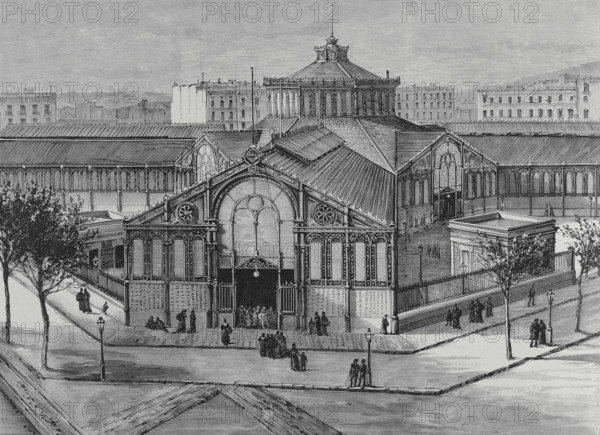 Barcelona, Catalonia, Spain. Exterior view of the new San Antonio Market (Mercat de Sant Antoni). The building was inaugurated on September 24, 1882, having been designed by architect Antoni Rovira i Trias (1816-1889) and built by La Maquinista Terrestre y Maritima. Engraving by Vela. La Ilustracion Espanola y Americana (The Spanish and American Illustration), 1883.