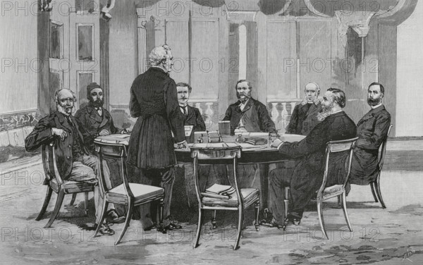 The Egyptian Conference. European conference on the affairs of Egypt held in London, 1884. Summit attended by the representatives of the major powers. The first session of the conference, on the afternoon of 28 June 1884, chaired by Lord Granville (British Foreign Secretary), in the meeting room of the Foreign Office. Scene of the meeting. Seated from left: Count Munster (Germany), Musurus Pasha (Turkey), Count de Nigra (Italy), Waddington (France), Baron de Staal (Russia), Childers (England) and Count Karoly (Austria-Hungary). Standing, starting the meeting, Lord Granville. Engraving by Bernardo Rico (1825-1894). The Spanish and American Illustration (La Ilustracion Espanola y Americana), 1884.