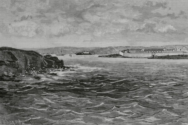 Port of Mahon (Port of Mao), Menorca, Balearic Islands, Spain. Lazaretto quarantine island (Illa del Llatzaret) and ruins of the Castle of San Felipe. The lazaretto was built in 1793 by the Count of Floridablanca, by order of King Carlos III. Due to the arrival of the bubonic plague to the coasts of Menorca by means of ships from northern Africa and the East, the king decided to provide a place to quarantine and observe ships coming from other countries suspected of contagion. Engraving by Tomas Carlos Capuz (1834-1899). The Spanish and American Illustration (La Ilustracion Espanola y Americana), 1884.