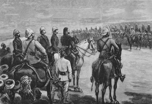 Mahdist War (1881-1899). Insurrection of Sudan. It faced the followers of Sudanese religious leader Muhammad Ahmad bin Abdullah bin Fahal, the self-proclaimed Mahdi, against Egyptian Khedivate troops, who were later joined by British forces. The Mudir of Dongola attending a review of the British troops, commanded by Herbert Stewart (1843-1885), after arriving from Wadi Halfa at the Mudir's court in August 1884. Stewart held the rank of brigadier-general, commanding a cavalry brigade that had been ordered to Khartoum to relief Major-General Charles George Gordon. Engraving by Vela. The Spanish and American Illustration (La Ilustracion Espanola y Americana), 1884.