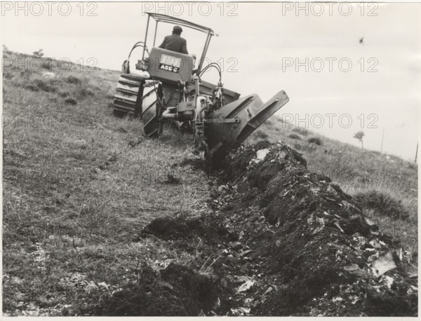 Reforestation a tractor machine preparing the field