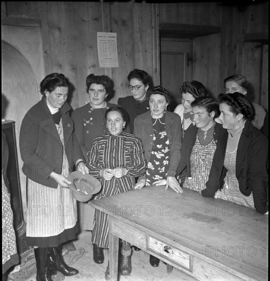 Boy raffling in Ardez, 1941.