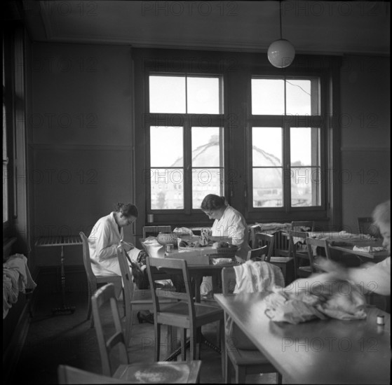 Women during World War 2; women sewing; 1940.