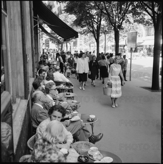 Passers-by at a street cafe, Zurich Bahnhoftrasse 1958.
