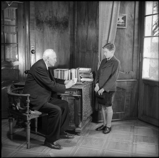 Teacher and Male Teenager in Community Home.