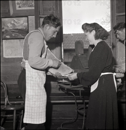 Preparing Raclette cheese on St. Barbara day in Salins.