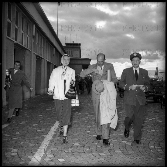 Arrival of ex-king Humbert II of Italy (c) with his wife Marie Jose in Geneva, 1954.