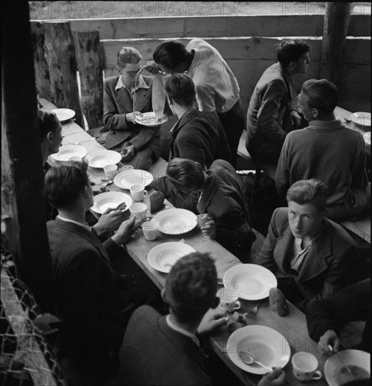 WW 2: farming camp; apprentices clearing a mountain pasture, lunch, 1942.