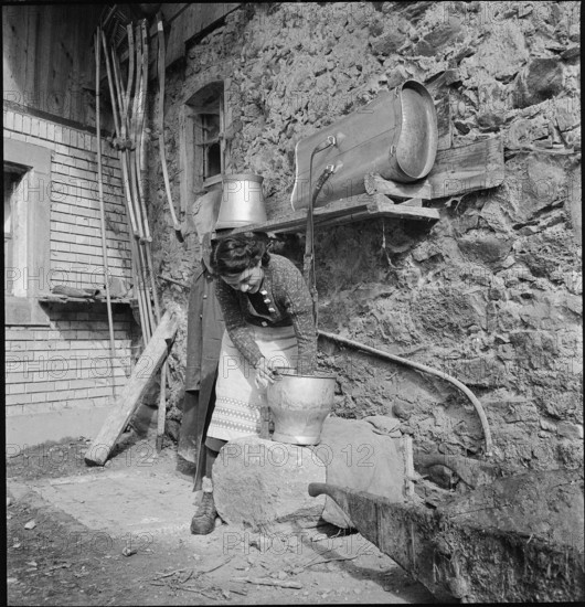 WW 2: farming camp; volunteer doing cleaning work, 1939.