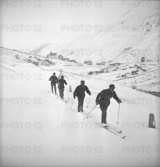 Group of soldiers on ski in snow, Andermatt 1949.