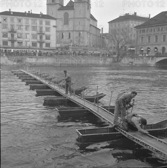 Pontooneers building rapid gangplank across Limmat, Zurich 1959.