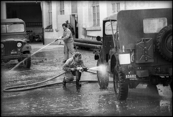 Women soldiers cleaning military jeeps, St. Gallen 1967.