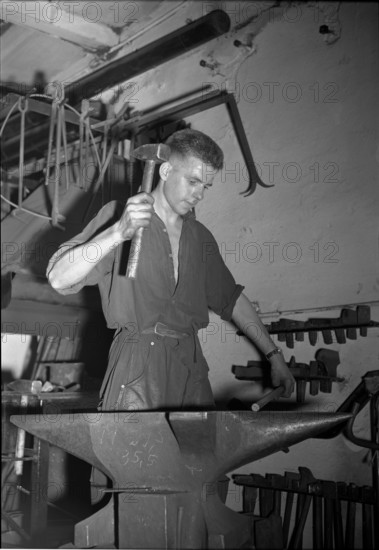 Blacksmith at the Anvil, 1950.