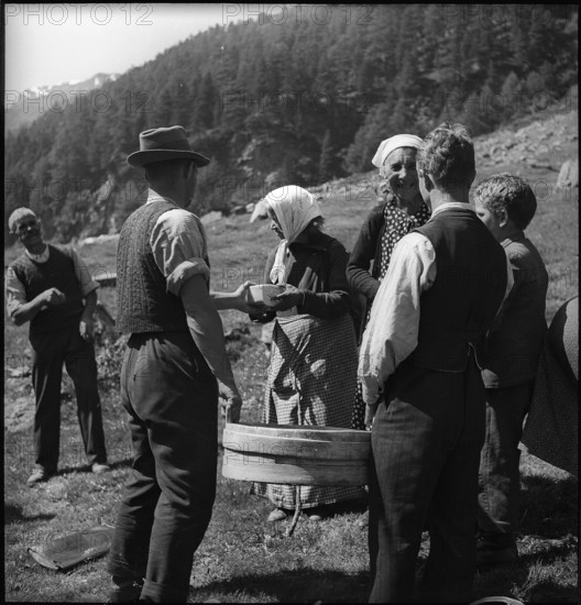 Cheese donation in the Turtmanntal valley, Switzerland, 1940.