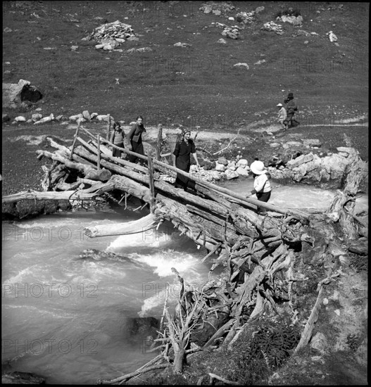 Farmers walk to the cheese donation in the Turtmanntal valley, Switzerland, 1940.