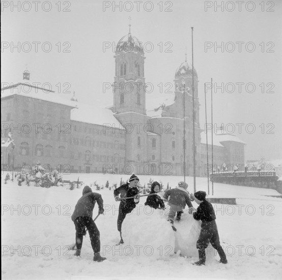 Einsiedeln; children playing in the snow; 1959.