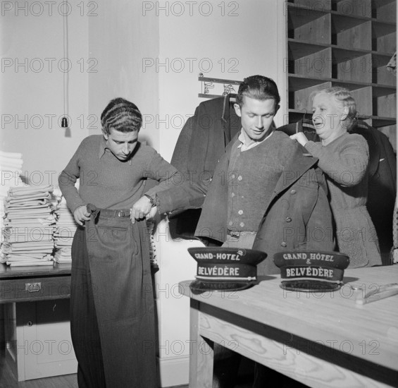 Davos: Employees of the Grand Hotel Belvedere are clothed; 1949.