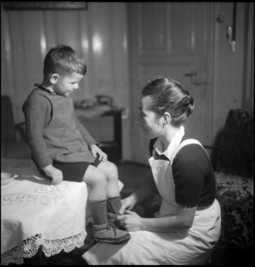 Domestic Servant with Child, around 1963.