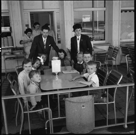 Gerold Zust with Hungarian children at airport Kloten 1957.